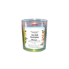 Intuition Flames Miriam candle from the Bloom and Flourish Collection, a 10 oz hand-poured coconut wax candle with a natural wood wick in an iridescent glass vessel. Features a radiant sea salt, jasmine, and lily petal fragrance inspired by the biblical prophetess Miriam. Clean-burning, toxin-free, perfect for worship, reflection, and spiritual growth.