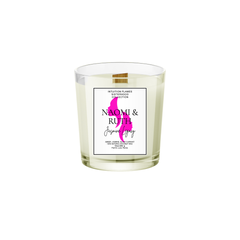 Intuition Flames Naomi and Ruth Jasmine Legacy Candle, 10 oz coconut wax candle with wooden wick in matte black glass jar. Features jasmine, amber, and black currant fragrance blend. Clean-burning, toxin-free, hand-poured for faith, loyalty, and spiritual reflection.